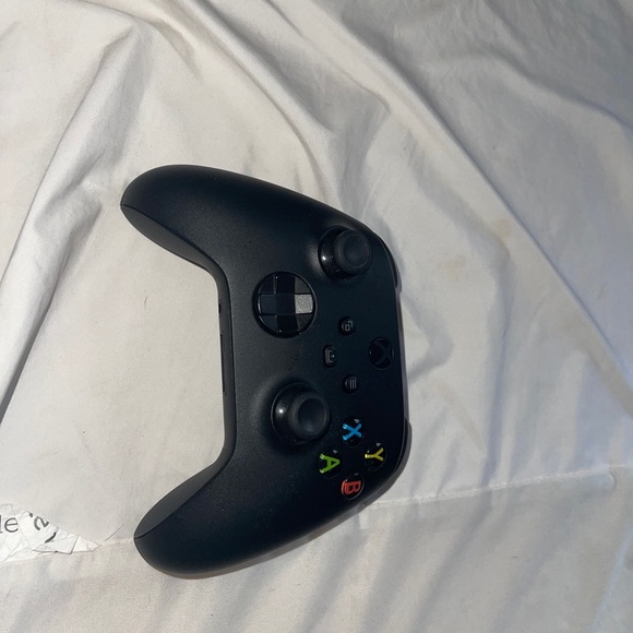 Xbox series X with controller and cables.
